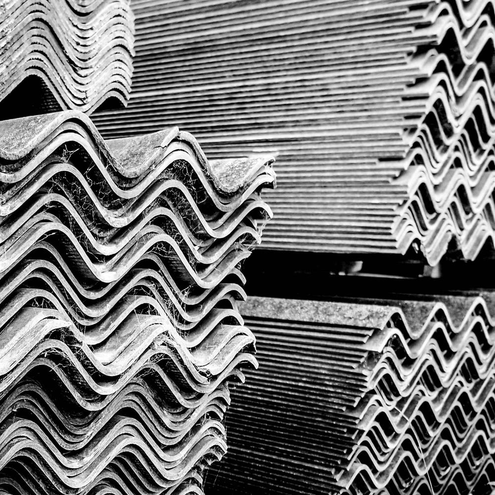 Corrugated cement roofing on a farm outbuilding.